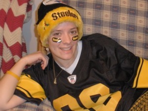 Brittany (me) wearing a Hines Ward throwback jersey, Steelers santa hat, and Steelers eyeblack stickers
